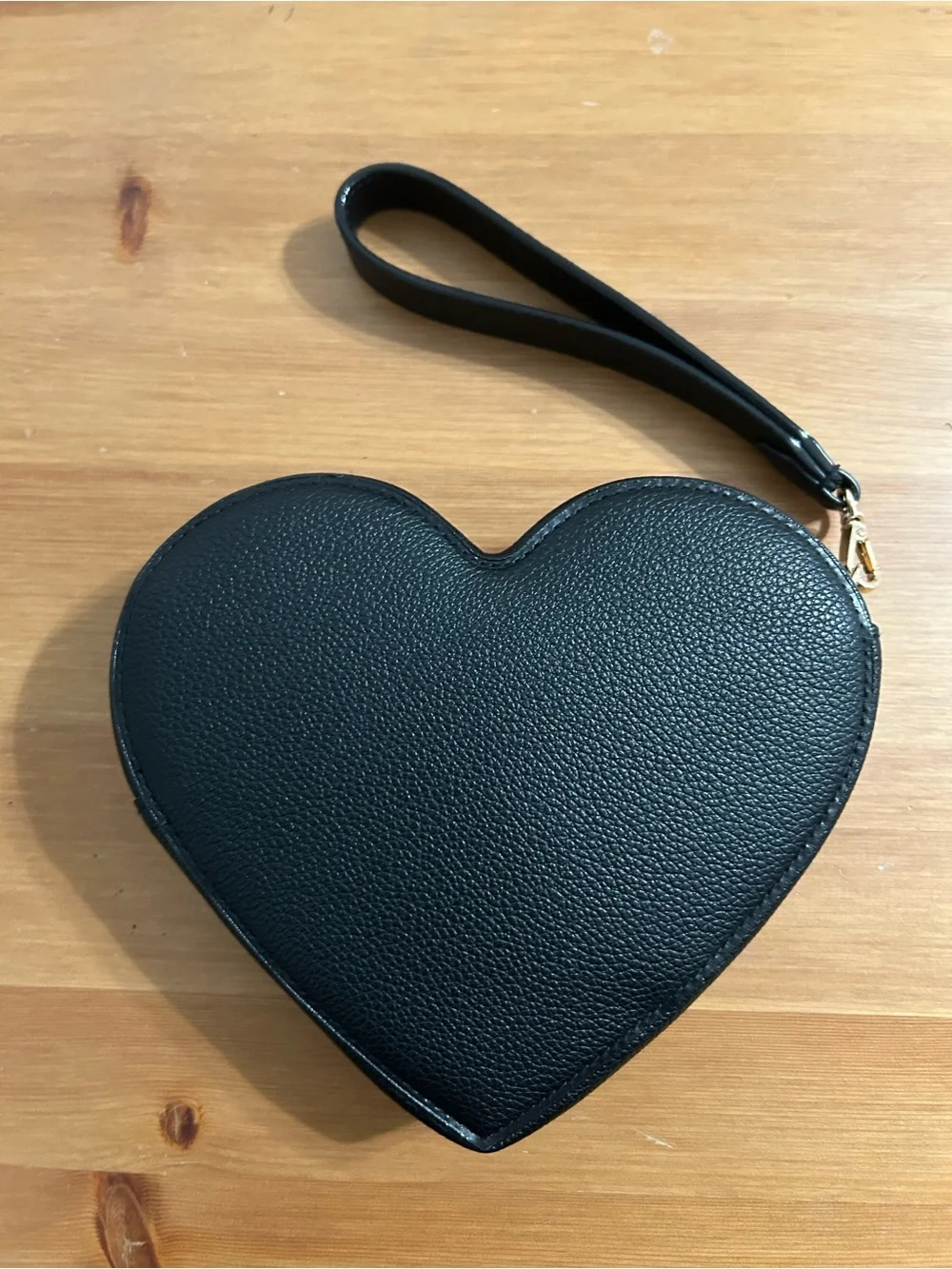 Victoria’s Secret heart clutch with removable strap in black and gold studs